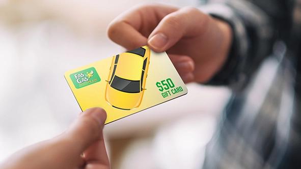 Two hands holding a Fas Gas gift card.