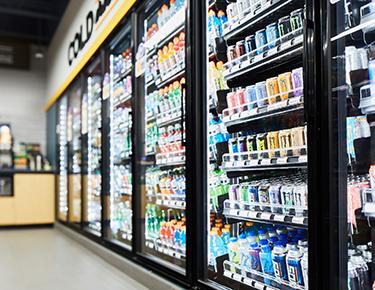 Beverages in cooler at convenience store.